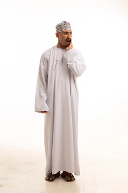 Omani Man in Traditional Dress with Pain Expression