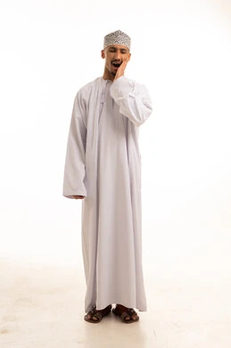 Tired Omani Man in Traditional Dress Yawning on White Background