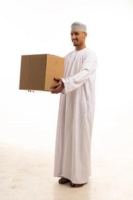 Omani Man Holding Cardboard Shipping Box in Studio