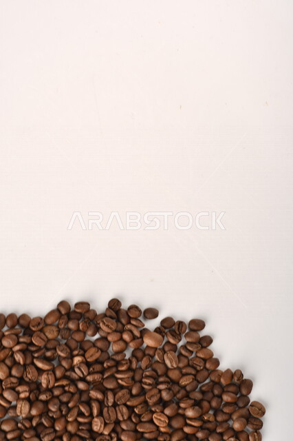 Close-up of roasted coffee beans, coffee beans, making and preparing fresh coffee, making hot drinks from coffee beans