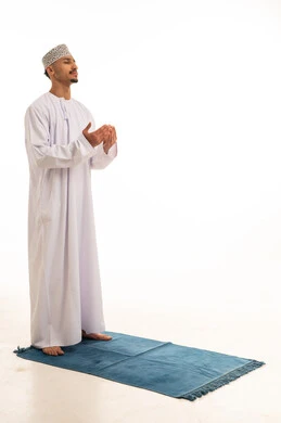 Omani Man in Traditional Dress Making Supplication