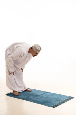 Omani Man Performing Ruku Prayer Position