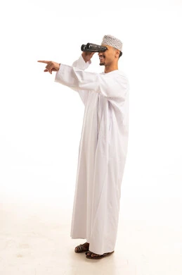 Omani Man in Traditional Dress Using Binoculars