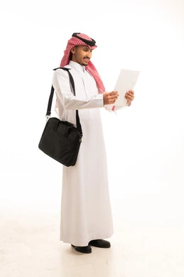 Saudi Man in Thobe Reading Document on White Background