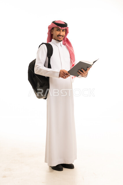 Saudi Student in Traditional Thobe Holding Book