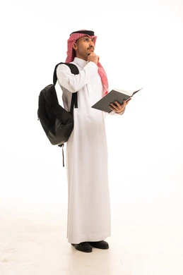 Saudi Student in Traditional Dress Thinking with Book