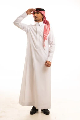 Saudi Man in Traditional Thobe Looking Away