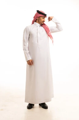 Saudi Man in Traditional Thobe Flexing Bicep Muscle