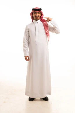Saudi Man in Traditional Thobe Pointing to Head