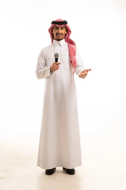 Saudi Man Holding Microphone in Traditional Thobe