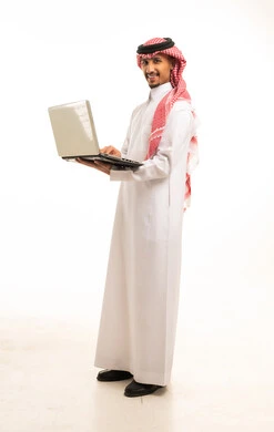 Saudi Man Using Laptop on White Background
