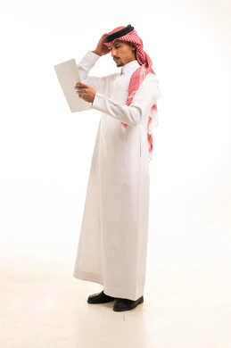 Saudi Man in Traditional Thobe Reading White Document