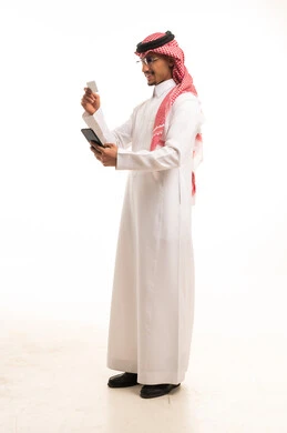 Saudi Man with Credit Card and Mobile Device