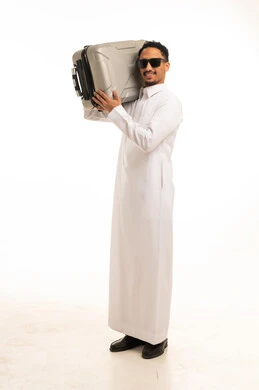 Saudi Man in White Thobe Carrying Suitcase Studio