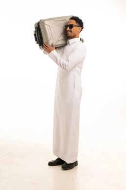 Saudi Man in Thobe Carrying Suitcase on White Background