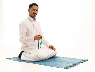 Saudi Man in Traditional Thobe with Prayer Beads