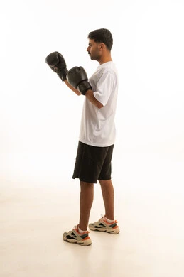 Saudi Man Boxing in Studio White Background