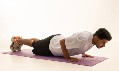 Arab Man Doing Pushups on Yoga Mat in Studio