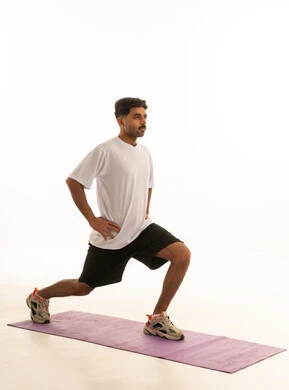 Arab Man Performing Lunges on Yoga Mat