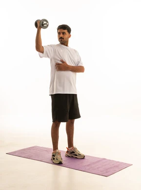Arab Man Exercising with Dumbbell on White Background