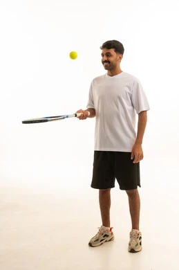 Saudi Man Playing Tennis in Sportswear Studio Shot
