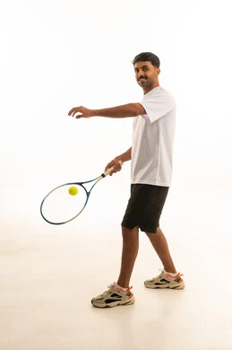 Saudi Man Playing Tennis in Studio Background