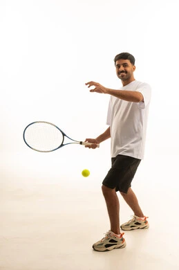 Saudi Man in Sportswear Holding Tennis Racket