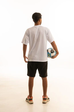 Arab Athlete Standing with Football on White Background