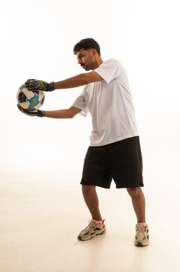 Saudi Goalkeeper Holding Football in Studio
