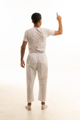 Saudi Man in Traditional Undergarments Pointing Up