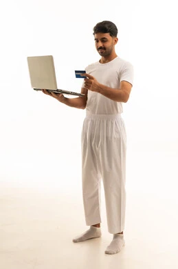 Saudi Man with Laptop and Credit Card Online Shopping