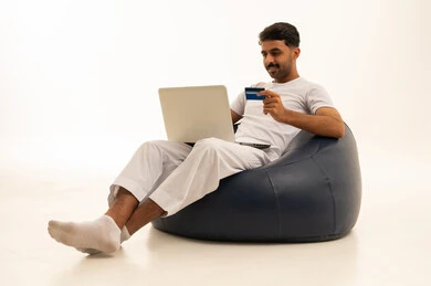 Saudi Man with Laptop and Credit Card Online Shopping