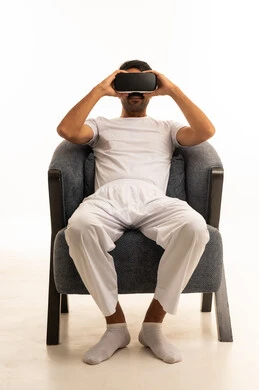 Arab Man Using Virtual Reality Headset on White Background