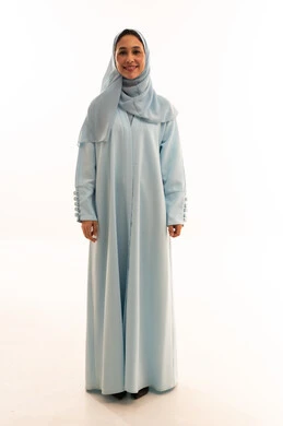 Emirati Woman in Blue Abaya on White Background