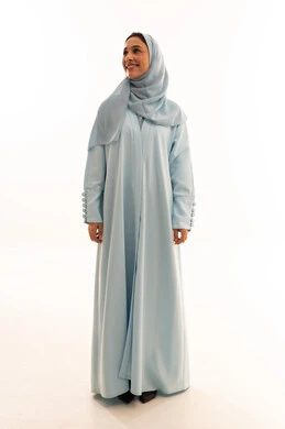 Saudi Woman in Blue Abaya on White Background Studio