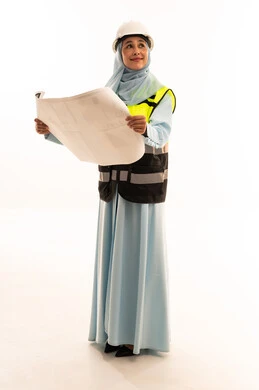 Arab Female Engineer with Blueprints in Studio