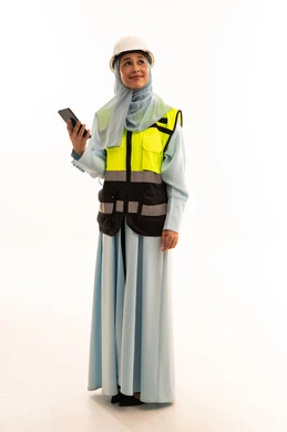 Saudi Female Engineer in Safety Gear with Smartphone