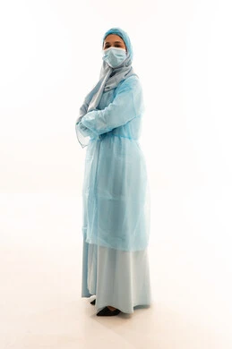 Saudi Female Healthcare Worker in Blue Protective Gown