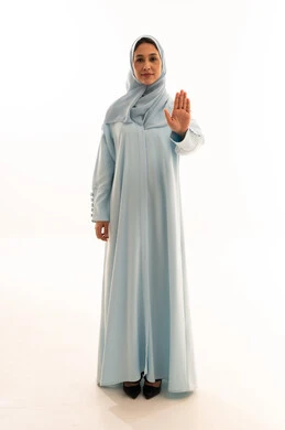 Arab Woman in Light Blue Abaya Making Stop Gesture