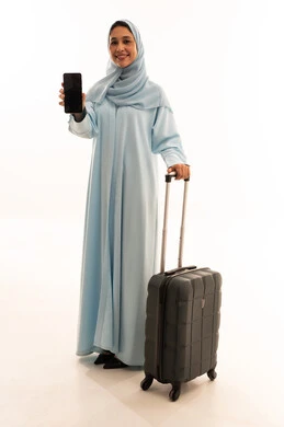 Emirati Woman with Suitcase and Smartphone on White