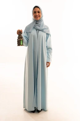 Arab Woman in Blue Abaya Holding Ramadan Lantern