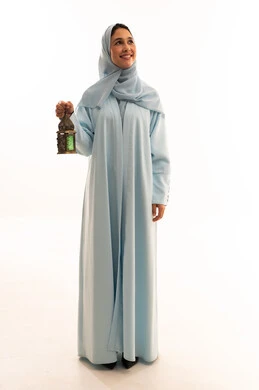 Arab Woman in Blue Abaya Holding Ramadan Lantern