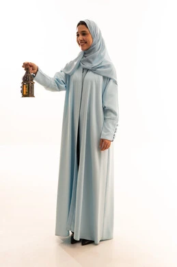 Arab Woman in Blue Abaya Holding Ramadan Lantern