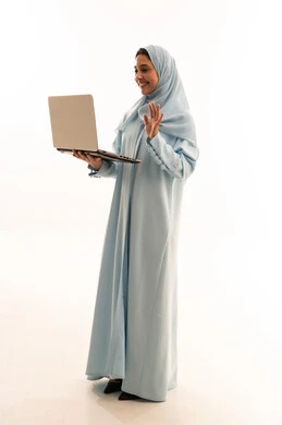 Arab Woman in Blue Abaya with Laptop on White Background