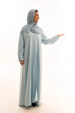 Arab Woman in Blue Abaya Presenting on White Background