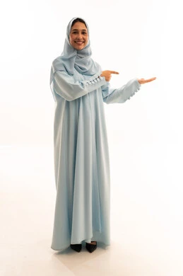Emirati Woman in Blue Abaya Presenting on White Background