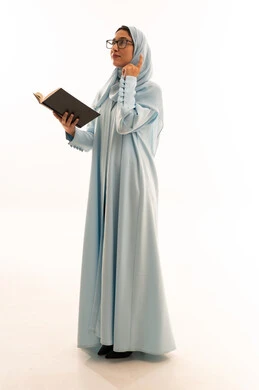 Saudi Woman in Blue Abaya Holding Book
