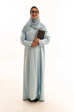 Saudi Woman in Blue Abaya Holding Book Studio Portrait