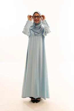 Saudi Woman in Blue Abaya and Hijab Wearing Glasses
