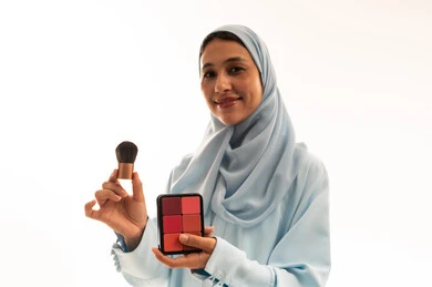 Arab Woman in Hijab Holding Makeup Palette